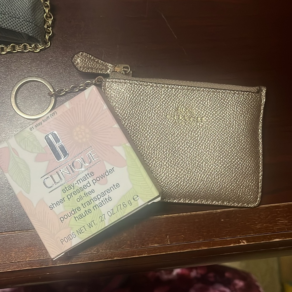 COACH BUNDLE WITH CLINIQUE Gold textured holder bundle with Clinique powder!